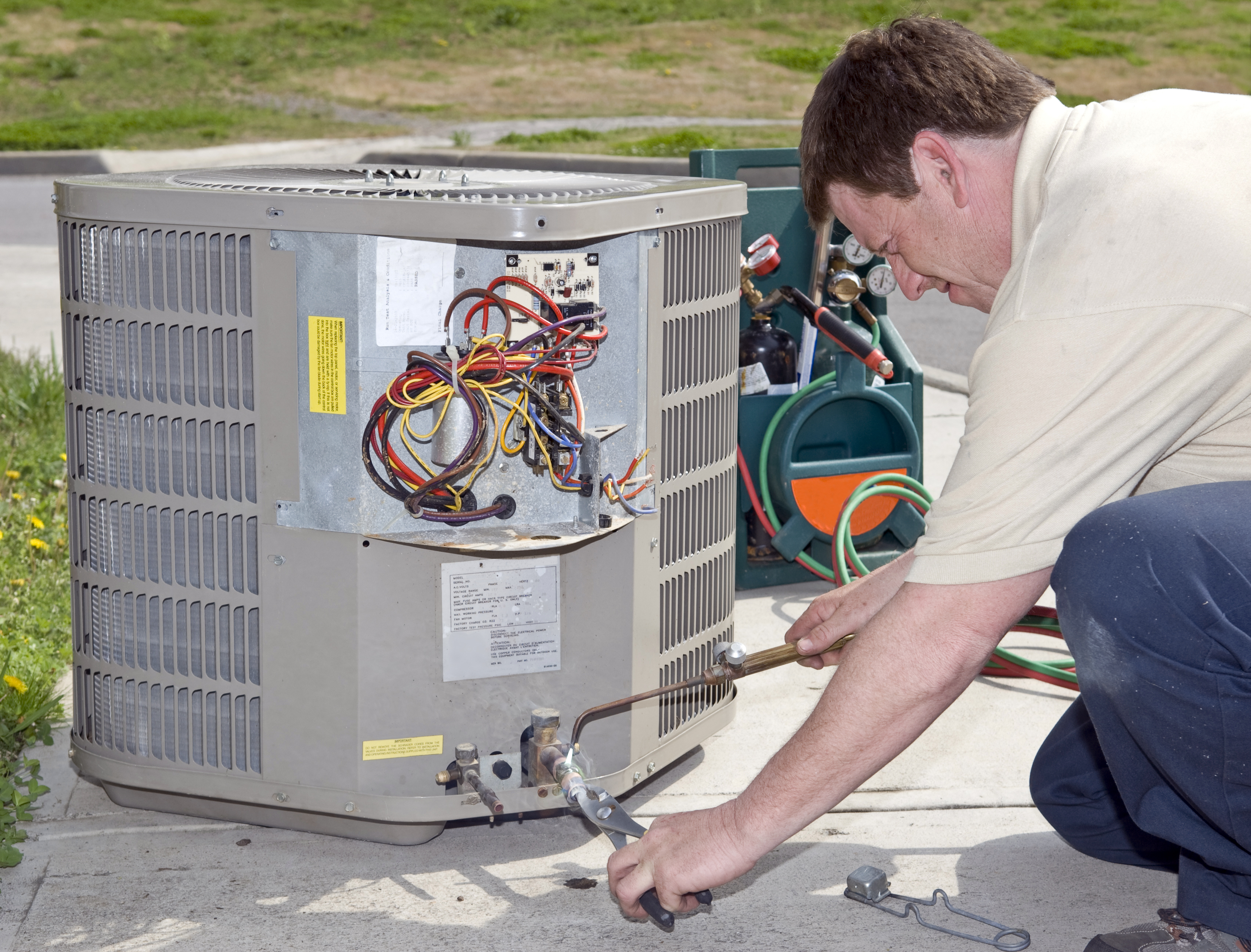 Air Conditioning Repair Man Checking Freon Levels